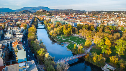 Aerial view of the city of Graz during autumn with the beautiful river Mur