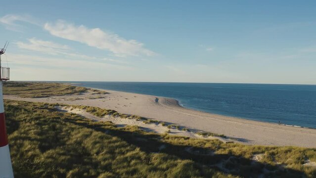 Sylt, Lighthouse Ellenbogen, Northernmost point of Germany. Schleswig-Holstein, North Sea. 4K drone. Beautiful tourist destination and attraction from above.