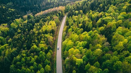 Aerial view of a car driving through the Black Forest mountain range, Germany