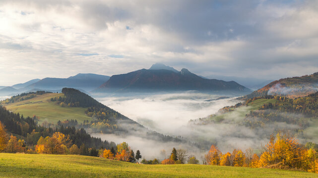 Mountain rural landscape in an autumn foggy morning. The Mala Fatra national park in northwest of Slovakia, Europe.
