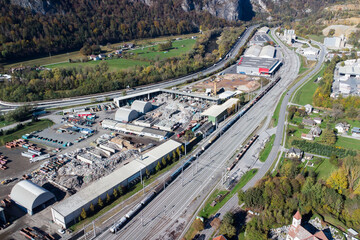 Industrial area of Peggau in Austria with rail tracks, logistic halls and a scrap yard
