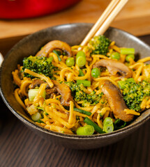 egg noodles with broccoli mushrooms and pea