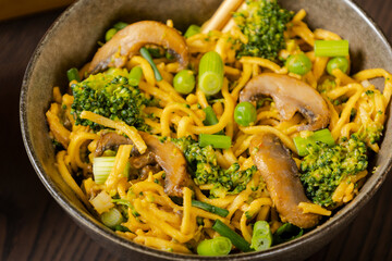 egg noodles with broccoli mushrooms and pea