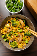egg noodles with broccoli mushrooms and pea