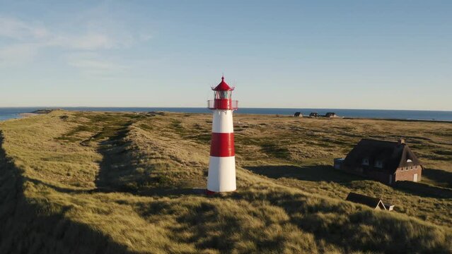 Sylt, Lighthouse Ellenbogen, Northernmost point of Germany. Schleswig-Holstein, North Sea. 4K drone. Beautiful tourist destination and attraction from above.