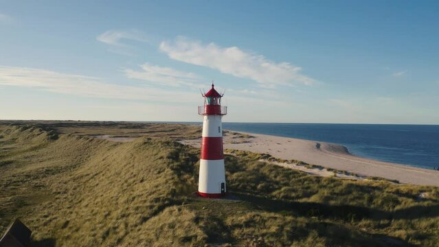 Sylt, Lighthouse Ellenbogen, Northernmost point of Germany. Schleswig-Holstein, North Sea. 4K drone. Beautiful tourist destination and attraction from above.