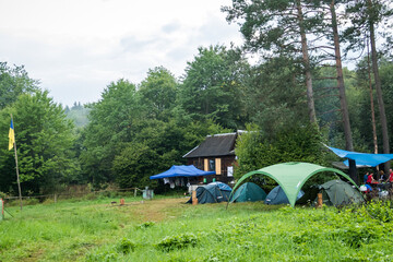 camping in the mountains with tents, log house, tourism, 