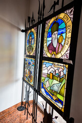 colorful frescoes, stained glass windows, depictions of people, history, culture