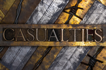 Casualties with barbed wire on grunge textured copper and gold background