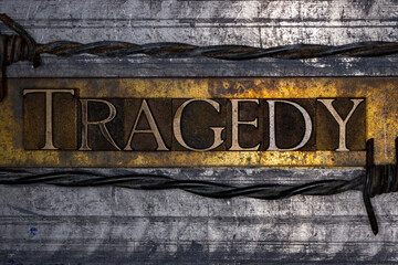 Tragedy with barbed wire on grunge textured copper and gold background