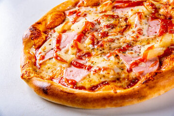 fast food. Hawaiian pizza with pineapple, ham, chicken, cheese, and vegetables