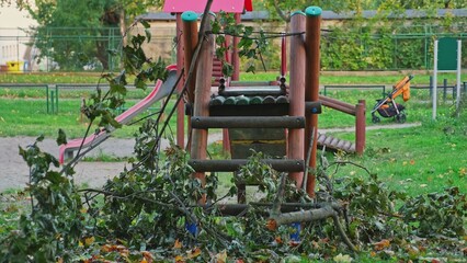 Kids Playground Equipment Damaged by Broken Tree Branches during Strong Wind Gale Storm Hurricane