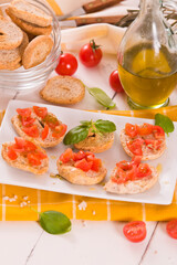 Friselle with cherry tomatoes and basil.
