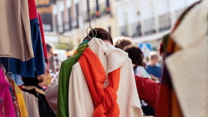 Girl looking at clothes in a flea market. The flea market. Madrid