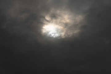 solar eclipse. astronomical phenomenon. the moon partially covers the sun.;
