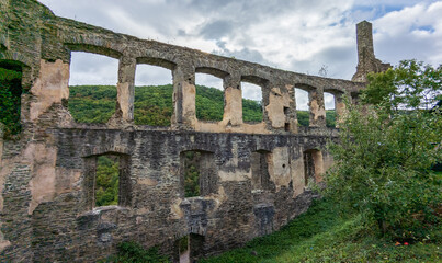 Path leads to the ruins of the castle in Beilstein, Germany, Rhineland. cloudy.