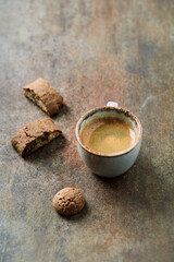 Cup of coffee on rustic stone background. Copy space.