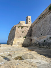 A world war 2 watchtowers on Fort Saint Elmo a 16th century star fort, overlooking the rock shore. - Valletta, Malta.