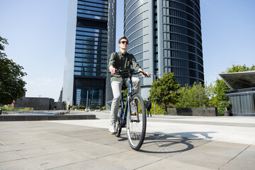 businessman rides e-bike