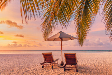 Amazing beach. Chairs on the sandy beach sea. Luxury summer holiday and vacation resort hotel for...
