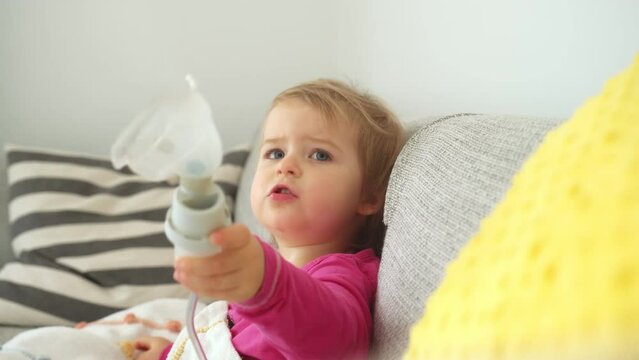 Adorable Caucasian Baby Girl Inhaling Medicine Steroids to Recover Respiratory Disease