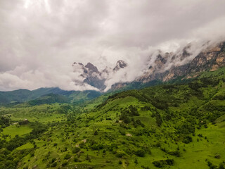 Amazing mountain landscape. Beautiful clouds, fields, mountains. Aerial view