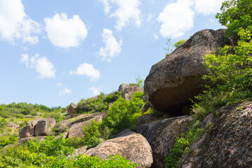 Large smooth stones on the bottom Arbuzynsky canyon near the Trykraty village, on the Arbuzynka river in the Voznesenskyi region of Mykolaiv Oblast of Ukraine