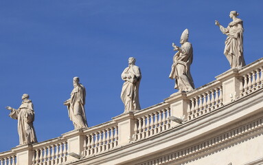 Fototapeta na wymiar St Peter's Basilica Colonnade Sculptures Detail in Rome, Italy