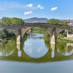 Fototapeta premium Puente la Reina, Spain - 31 Aug, 2022: Arches of the roman Puente la Reina foot bridge, Navarre, Spain