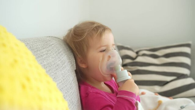 Adorable Caucasian Baby Girl Inhaling Medicine Steroids to Recover Respiratory Disease