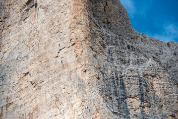 Mountaineers climbing up the 3 Zinnen in the dolomite mountains