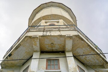 Exterior view of an old watchtower in Indonesia in daylight on a blue sky background