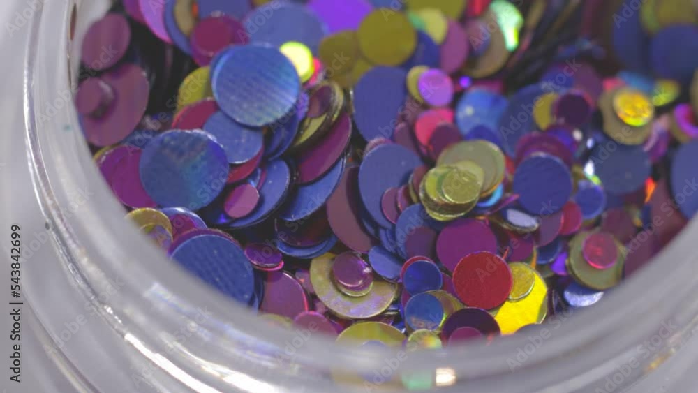 Poster decorative sequins in a jar rotate in a circle