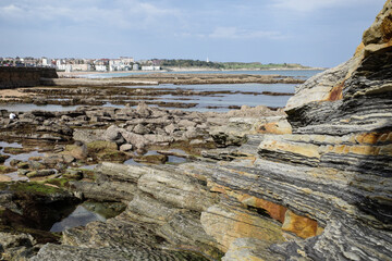 Santander, Spain - 31 Oct, 2022: Rock formations on the coast of the Magdalena Peninsula and Playa...