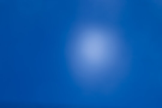 Blue defocused abstract smooth asymmetric gradient background