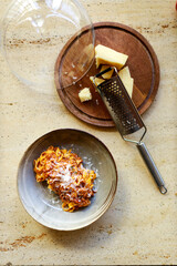 Ready-made national Italian dish pasta with bolognese sauce with parmesan cheese