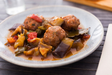 steamed meatballs with stewed vegetables with haze on plate