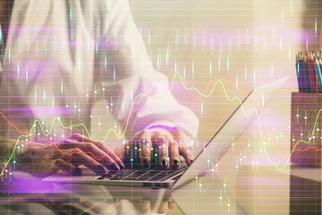 Double exposure of woman hands typing on computer and forex chart hologram drawing. Stock market invest concept.