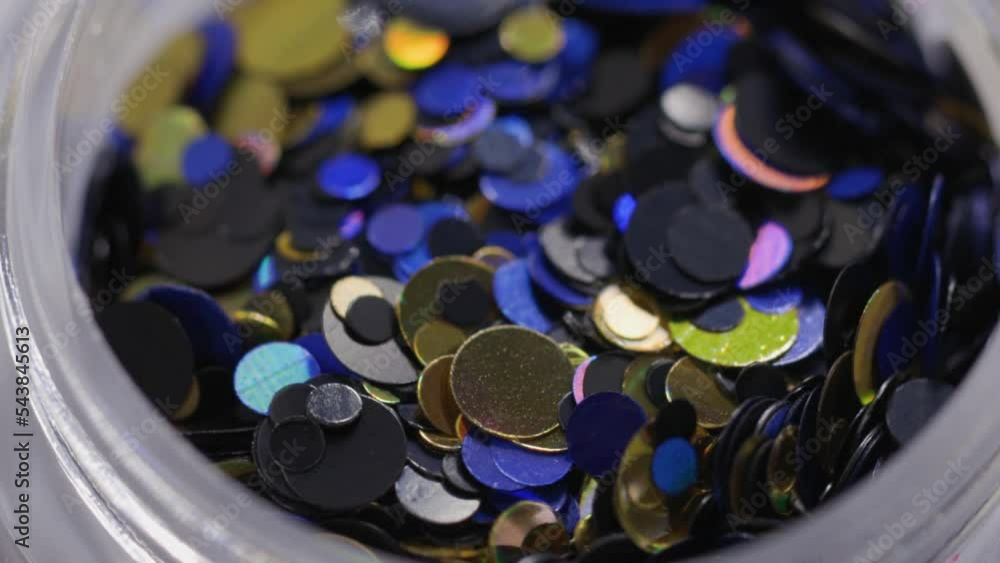 Poster purple sequins in a jar rotate in a circle