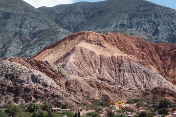 Scenic shot of the Hill of Seven Colours mountains in the background of tiny Purmamarca, Argentina