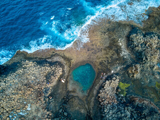 Aerial view of a natural pool in Caleta de Fuste Fuerteventura island drone photography