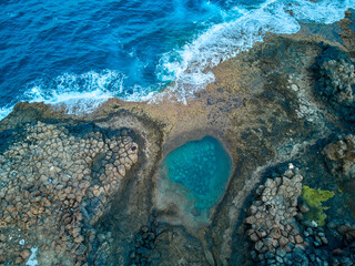 Aerial view of a natural pool in Caleta de Fuste Fuerteventura island drone photography