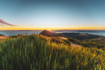 Madeira sunrise photographed from the beautiful mountain landscape of Pico do Ariero. Pico do Arieiro, Madeira Island, Portugal, Europe.