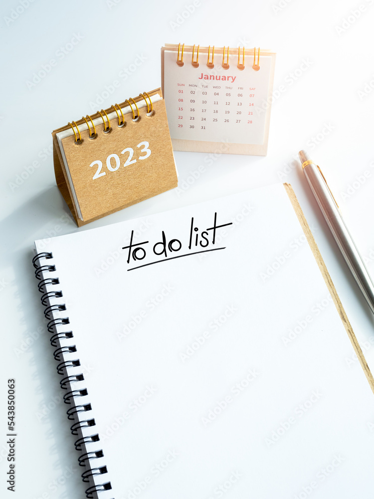 Aufkleber goals and target concept in new year 2023. to do list, text on white blank space on spiral notepad, 