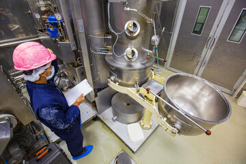 Male record operation black protective clothes process in a food factory. the processing production...