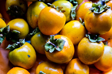 Sweet persimmons are piled up