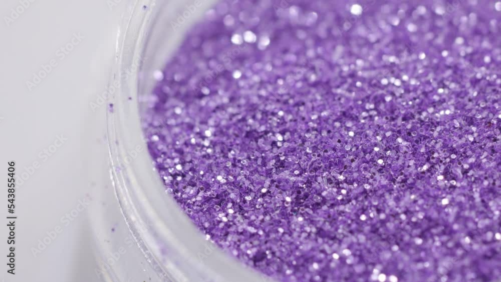 Poster purple sequins in a jar rotate in a circle
