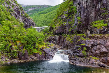 Fototapeta na wymiar The waterfall in a stream