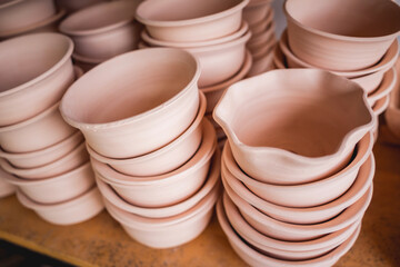 Ceramic plates on the table at the workshop