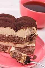 Tasty creamy tiramisu cake and black coffee for different occasions. Delicious dessert